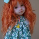 ruby red doll blue bow red hair