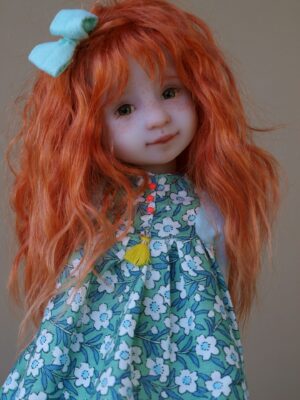 ruby red doll blue bow red hair