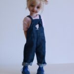 ruby red doll white hair and blue pants